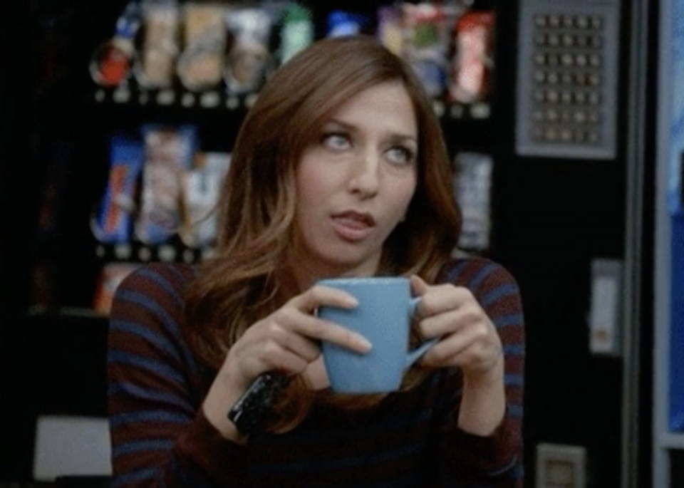 a girl rolling her eyes holding her mug