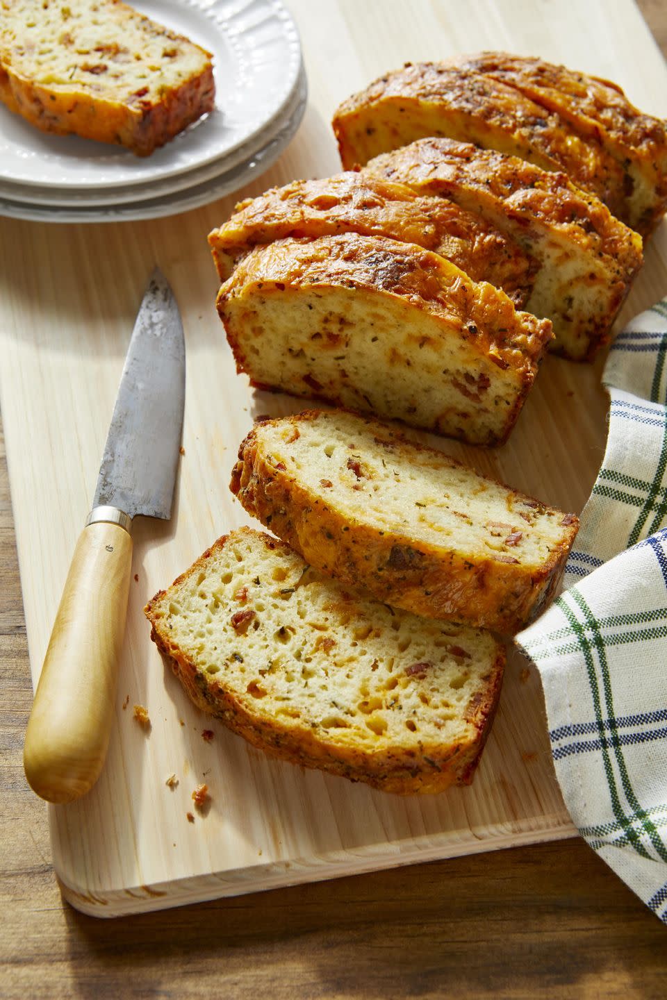 <p>More in the mood for a savory breakfast-type treat? Bake this, and the smell will have the whole family gathered in the kitchen.</p><p><strong><a href="https://www.countryliving.com/food-drinks/a32213633/cheddar-bacon-and-chive-quick-bread/" rel="nofollow noopener" target="_blank" data-ylk="slk:Get the recipe;elm:context_link;itc:0;sec:content-canvas" class="link ">Get the recipe</a>.</strong></p><p><a class="link " href="https://www.amazon.com/USA-Pan-1140LF-Bakeware-Aluminized/dp/B0029JQEIC/?tag=syn-yahoo-20&ascsubtag=%5Bartid%7C10050.g.35246097%5Bsrc%7Cyahoo-us" rel="nofollow noopener" target="_blank" data-ylk="slk:SHOP LOAF PANS;elm:context_link;itc:0;sec:content-canvas">SHOP LOAF PANS</a><br></p>