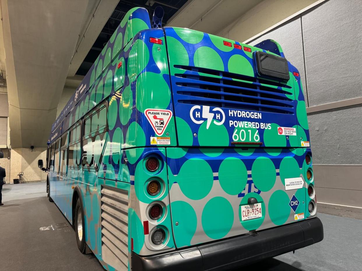 An Edmonton Transit Service hydrogen-fuelled bus sits on the exhibition floor at the 2024 Canadian Hydrogen Convention. (Madeline Smith/CBC - image credit)