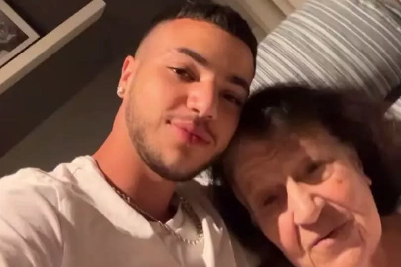 Junior Andre with his grandmother