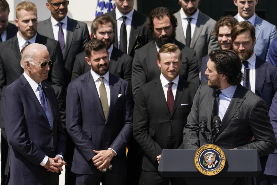 Tampa Bay Lightning's Ryan McDonagh looks at President Joe Biden as he speaks during an event to celebrate the Tampa Bay Lightning's 2020 and 2021 Stanley Cup championships at the White House, Monday, April 25, 2022, in Washington. (AP Photo/Andrew Harnik)