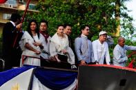 The casts of the MMFF 2012 entry "El Presidente" are seen as their float makes its way through the crowd at the 2012 Metro Manila Film Festival Parade of Stars on 23 December 2012. (L-R) Alicia Mayer, Cesar Montano, Cristine Reyes, Governor E.R. Ejercito, Christopher de Leon and Bayani Agbayani. (Angela Galia/NPPA Images)
