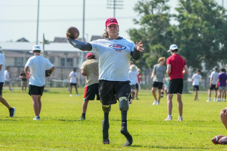 Calder Hodge, a 17-year-old quarterback from Houston, throws a football during the Manning Passing Aacdemy held at Nicholls State in Thibodaux, La, on June 24.