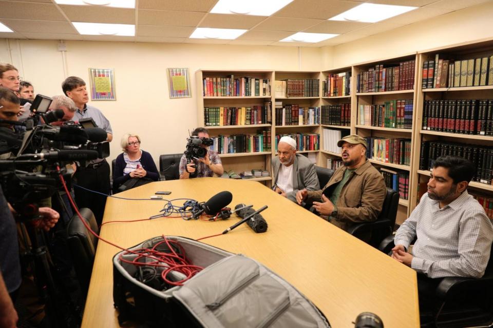 Nassar Mahmood (second right) of Birmingham Central Mosque and Ali Mohamed (third right), a representative of the local Sudanese community, speak during a press conference at the mosque. (PA Wire)