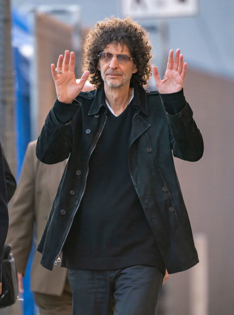 Howard holding up his hands