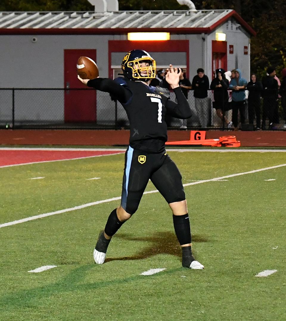 Matt Ponatoski completes a long pass for a Moeller first down in OHSAA Division I region football playoff action at Pat Mancuso Field, Nov. 11, 2023.