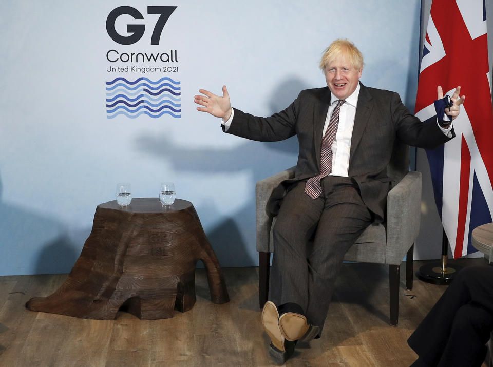 Britain's Prime Minister Boris Johnson meets with European Commission President Ursula von der Leyen and European Council President Charles Michel during the G7 summit in Cornwall, England, Saturday June 12, 2021. (Peter Nicholls/Pool via AP)