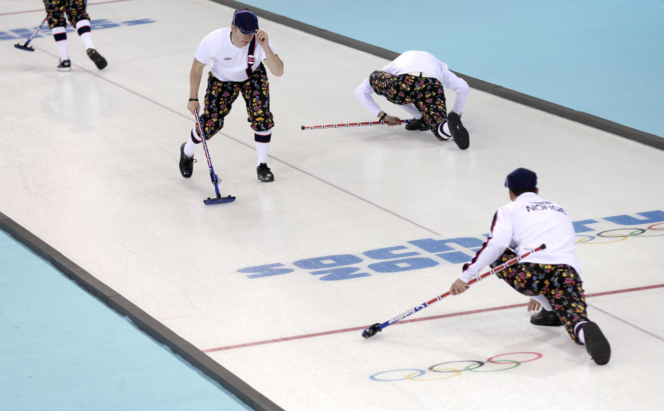 Norway's men's curling team warm up on the curling ice sheet during the first day of training at the 2014 Winter Olympics, Saturday, Feb. 8, 2014, in Sochi, Russia. (AP Photo/Wong Maye-E)