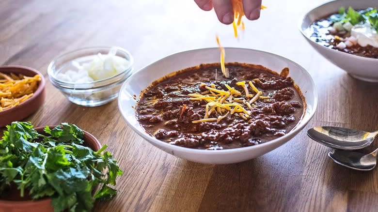 chili in bowl with cheese