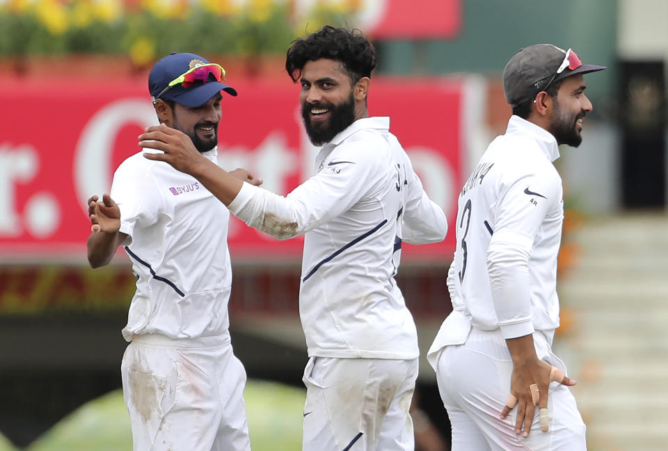 India's Ravindra Jadeja, center, celebrates with teammates the dismissal of South Africa's Zubayr Hamza during the third day of third and last cricket test match between India and South Africa in Ranchi, India, Monday, Oct. 21, 2019. (AP Photo/Aijaz Rahi)