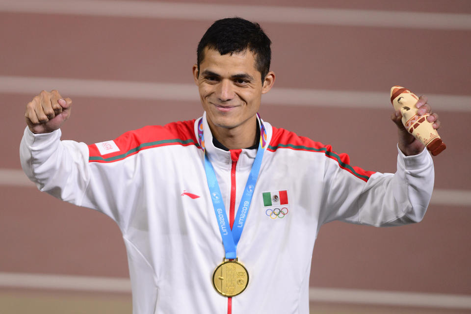 LIMA, PERU - AUGUST 06: Fernando Martinez of Mexico celebrates after winning gold medal during Athletics Men's 5000m Final on Day 11 of Lima 2019 Pan American Games at Athletics Stadium of Villa Deportiva Nacional on August 6, 2019 in Lima, Peru. (Photo by Gustavo Garello/Jam Media/Getty Images)