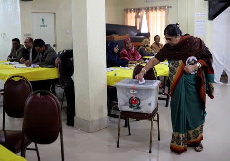 A woman casts her ballot during the general election in Dhaka, Bangladesh December 30, 2018. REUTERS/Mohammad Ponir Hossain