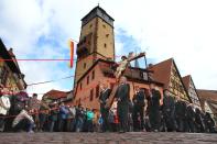 Thirteen life-sized figures representing the Passion of Christ are carried through the town during the traditional Good Friday procession in Lohr am Main, southern Germany, Friday, April 18, 2014. (AP Photo/dpa, Karl-Josef Hildenbrand)