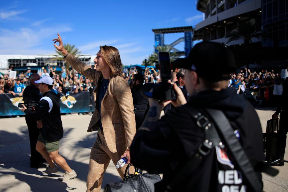 Jaguars' quarterback Trevor Lawrence, seen here waving to the crowd during a fans' sendoff before the team departed to play the Kansas City Chiefs at Arrowhead Stadium, further endeared himself to the fan base by penning a thank-you letter for their loyalty to The Players Tribune.