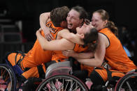 Player from Netherlands celebrate after defeating Germany in a women's wheelchair basketball semifinal game at the Tokyo 2020 Paralympic Games, Thursday, Sept. 2, 2021, in Tokyo, Japan. Paralympic Games begins on Monday, May 20, 2024 and features three Paralympic athletes alone in an empty stadium with the slogan: “Il ne me manque rien, sauf vous” (I’m not missing anything, except you). (AP Photo/Kiichiro Sato, File)