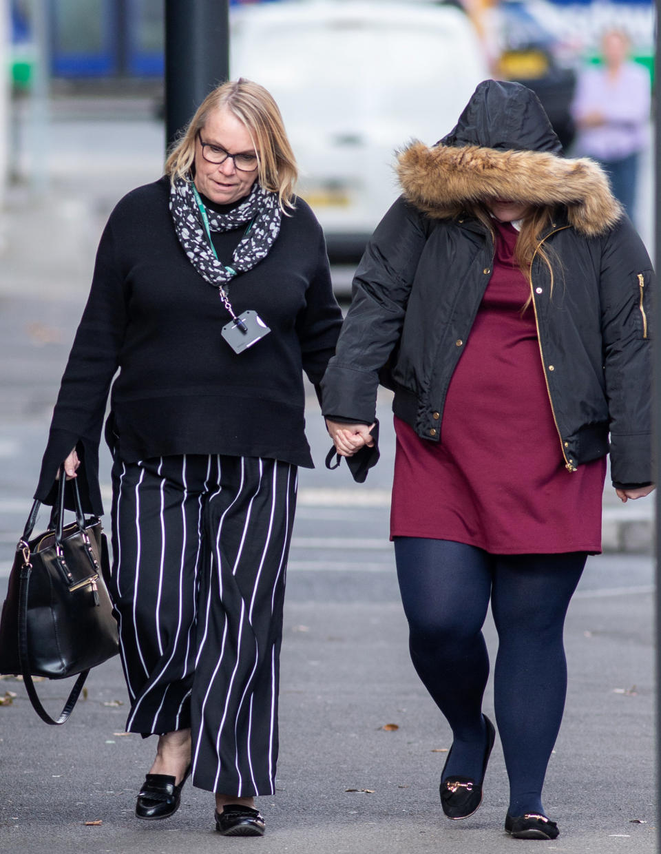 Sophie Elms, 18, right, pictured walking to a previous court appearance.Elms has been jailed for seven years and 10 months for 16 offences. (SWNS)