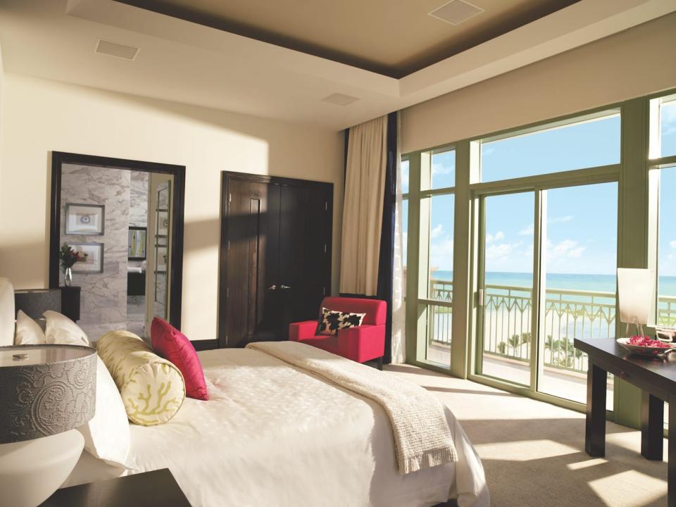 A bedroom in the three-bedroom penthouse suite inside at The Cove.
