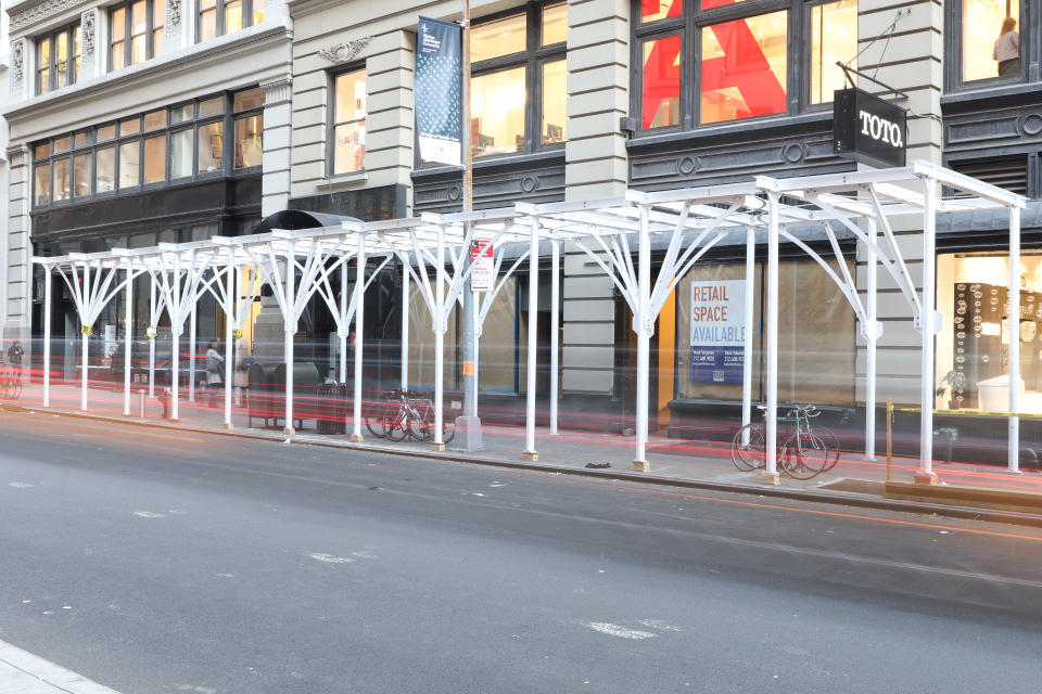 An 140-linear-foot Urban Umbrella installation at 20 W. 22nd St. in the Flatiron District of Manhattan. [Photo credit: Grahm Barnard]