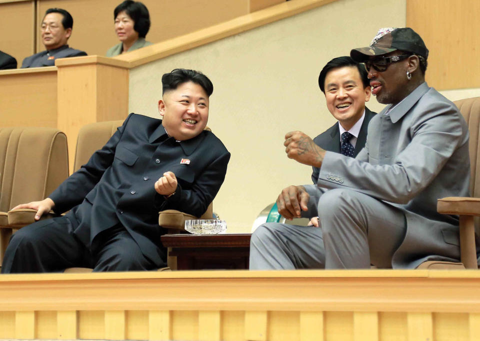 <em>North Korean leader Kim Jong-un, left, talks with Rodman as they watch an exhibition basketball game at an indoor stadium in Pyongyang (AP)</em>