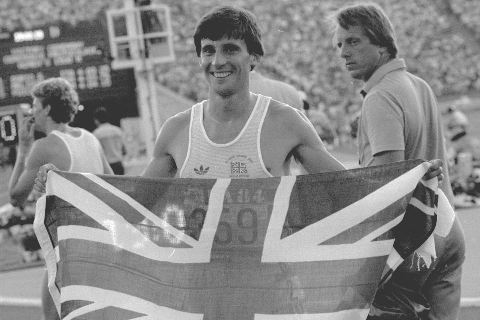 FILE - In this Aug. 11, 1984, file photo, Britain's Sebastian Coe holds up the Union Jack after winning the men's 1,500-meter race at the Summer Olympic Games in Los Angeles. (AP Photo/Dieter Endlicher, File)