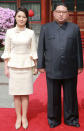 <p>This picture from North Korea’s official Korean Central News Agency (KCNA) taken on March 27, 2018 and released on March 28, 2018 shows North Korean leader Kim Jong Un and his wife Ri Sol Ju posing for a picture in Beijing. (Photo: KCNA VIA KNS AFP/Getty Images) </p>