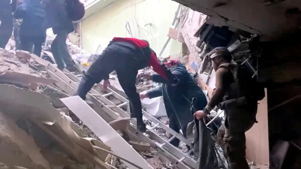 A woman is seen being assisted during an evacuation of the Azovstal plant, in a still image from a video released by the Ukrainian military on Sunday.