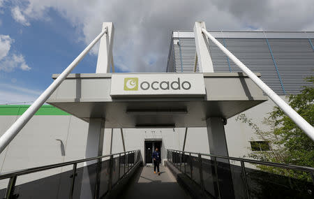 FILE PHOTO: A man walks from the main reception of the Ocado CFC (Customer Fulfilment Centre) in Andover, Britain May 1, 2018. REUTERS/Peter Nicholls