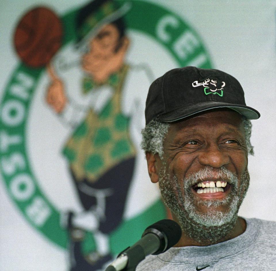 FILE - Boston Celtics legendary center Bill Russell has a light moment while answering questions from members of the media after a Celtics team practice in Waltham, Mass., Oct. 11, 1999. The NBA great Bill Russell has died at age 88. His family said on social media that Russell died on Sunday, July 31, 2022. Russell anchored a Boston Celtics dynasty that won 11 titles in 13 years. (AP Photo/Angela Rowlings)