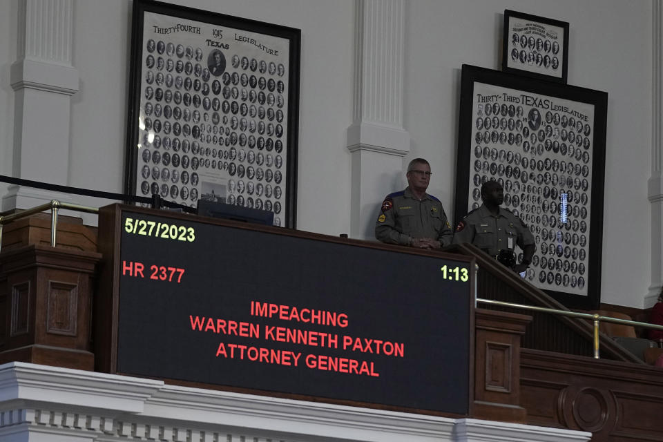 Texas troopers watch over the impeachment proceedings against state Attorney General Ken Paxton in the House Chamber at the Texas Capitol in Austin, Texas, Saturday, May 27, 2023. Texas lawmakers have issued 20 articles of impeachment against Paxton, ranging from bribery to abuse of public trust as state Republicans surged toward a swift and sudden vote that could remove him from office. (AP Photo/Eric Gay)