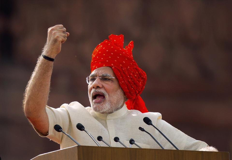 FILE- In this Aug. 15, 2014 file photo, Indian Prime Minister Narendra Modi addresses the nation on the country's Independence Day in New Delhi, India. The prime minister of the world’s largest democracy has clamped down on Kashmir to near-totalitarian levels. Modi, who became a Hindu nationalist before he reached adolescence, has upended life in India’s only Muslim-majority state, flexing his political muscles for his millions of followers. (AP Photo/Saurabh Das, File)