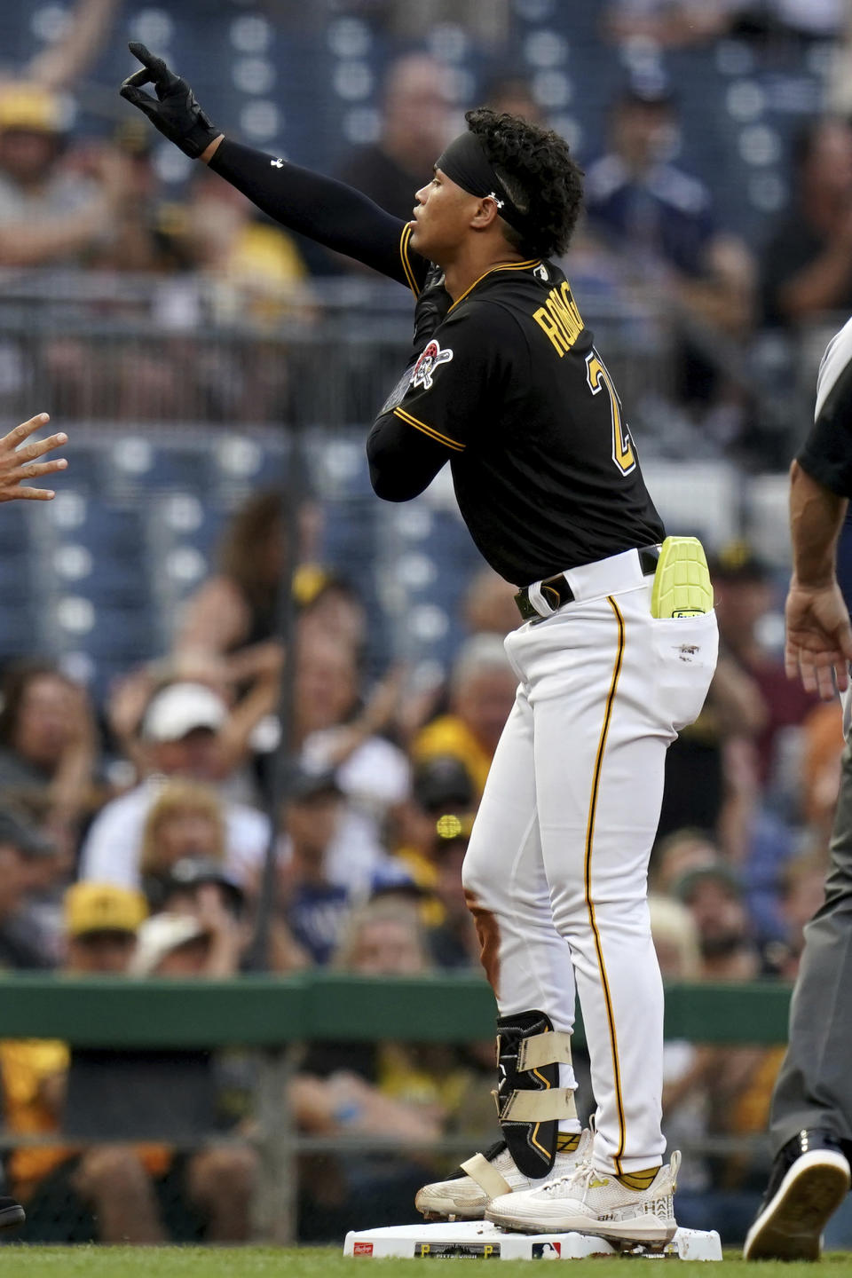 Pittsburgh Pirates' Endy Rodriguez reacts after hitting a triple against the Detroit Tigers during the second inning of a baseball game in Pittsburgh, Tuesday, Aug. 1, 2023. (AP Photo/Matt Freed)