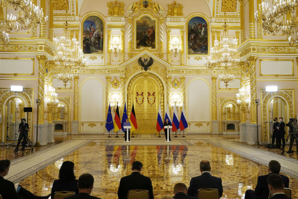 Russian President Vladimir Putin, center right, and German Chancellor Angela Merkel attend a joint news conference following their talks in the Kremlin in Moscow, Russia, Friday, Aug. 20, 2021. The talks between Merkel and Putin are expected to focus on Afghanistan, the Ukrainian crisis and the situation in Belarus among other issues. (AP Photo/Alexander Zemlianichenko, Pool)