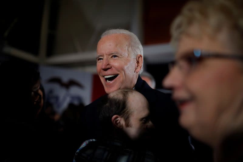 A supporter hugs Democratic 2020 U.S. presidential candidate and former Vice President Joe Biden during a campaign event in Ankeny, Iowa, U.S.