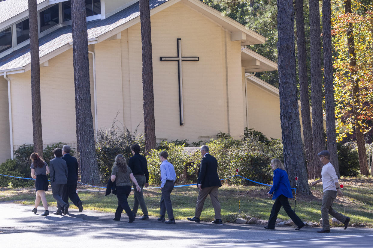 Mourners gather for the funeral of Susan Karnatz, 49, at North Raleigh Presbyterian Church in Raleigh, N.C., on Saturday, Oct. 22, 2022. Karnatz was one of five killed during a mass shooting Thursday, Oct. 13 in the city's Hedingham neighborhood and on the nearby Neuse River Trail greenway. (Travis Long/The News & Observer via AP)