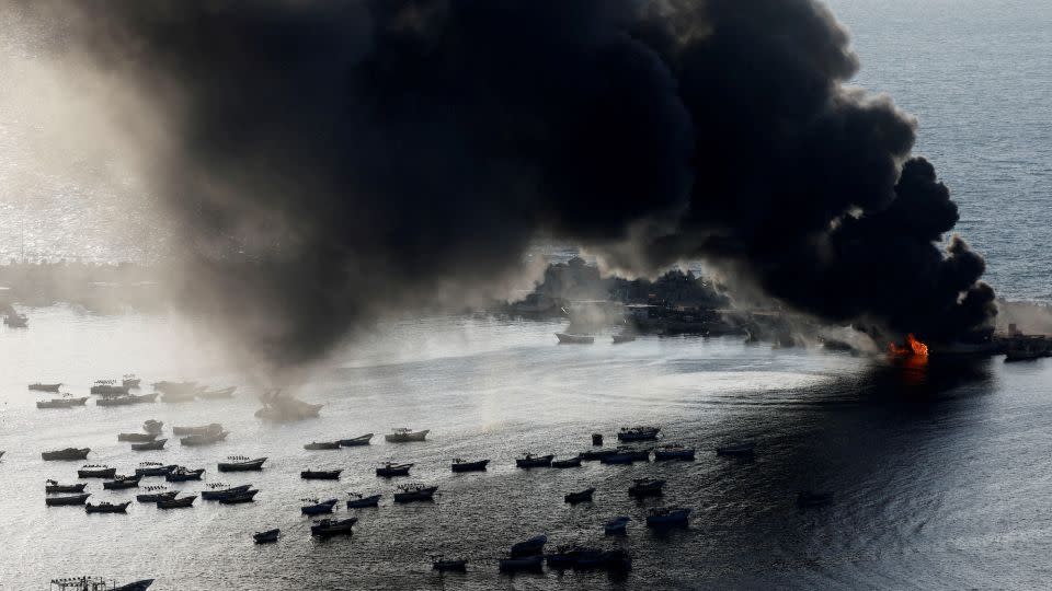 Smoke rises after Israeli strikes on the seaport of Gaza City on October 10.  - Mohammed Salem/Reuters