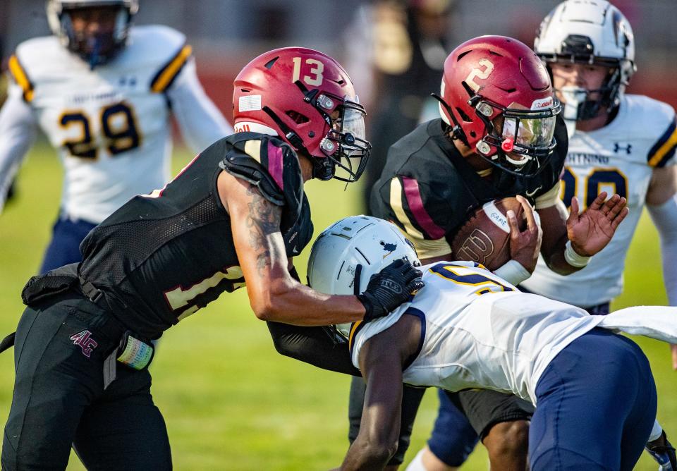 Lake Gibson (2) Fentrell Graham gets a block from (13) Kordell Lewis as he runs towards the end zone while pressured by a Lehigh defender during first half action at Lake Gibson High School in Lakeland Fl. Friday September 8 ,2023.Ernst Peters/The Ledger