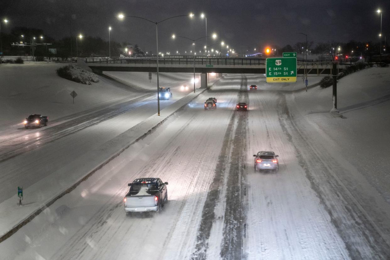 Traffic moves on I-235 as blizzard conditions hit Des Moines on Friday, Jan. 12, 2024.