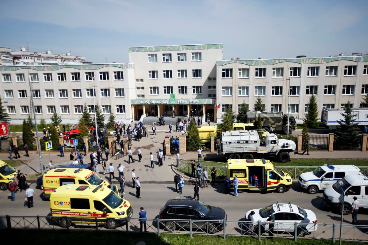 Ambulances and police cars and a truck are parked at a school after a shooting by Ilnaz Galyaviev in Kazan, Russia, in May 2021 (Copyright 2021 The Associated Press. All rights reserved)