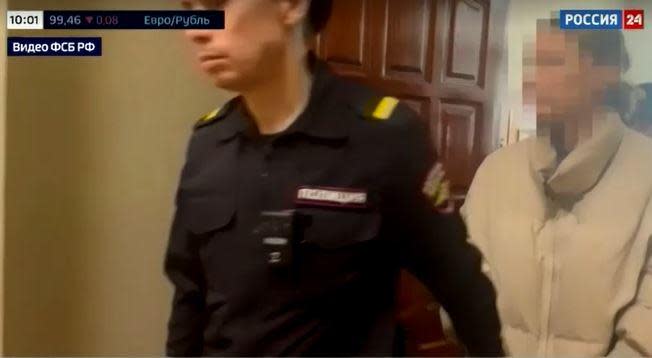 A screengrab from video aired on Feb. 20, 2024 by Russia's state-run broadcaster RU24 shows a woman identified by the FSB security service as a dual U.S.-Russian national from Los Angeles being led into a courtroom in Yekaterinburg after her arrest on suspicion of treason. / Credit: Reuters/RU24