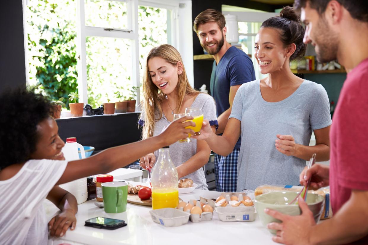 Group of friends having a breakfast party