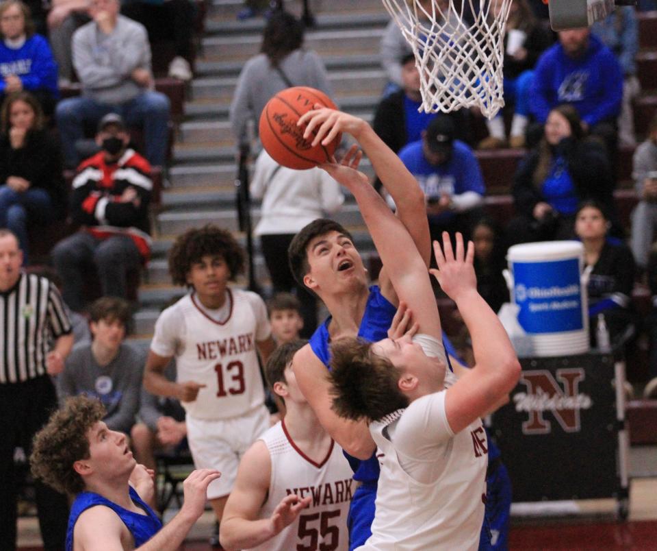 Hilliard Bradley's Cade Norris blocks the shot of Newark's Steele Meister in the post during the visiting Jaguars' 51-31 victory at Jimmy Allen Gymnasium.