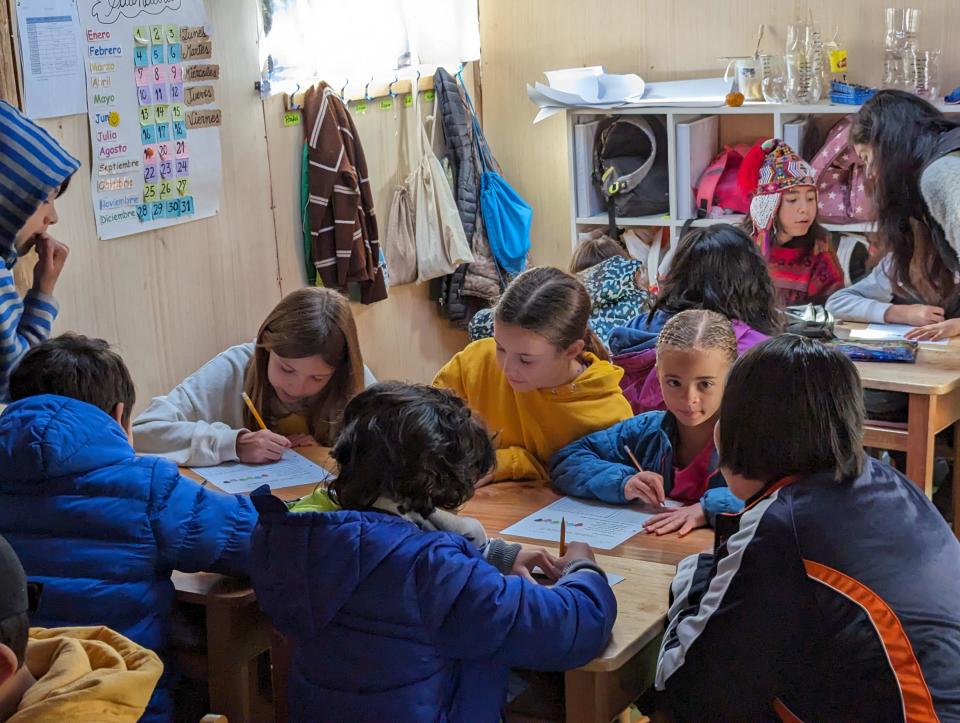 Children learn at a local school in Peru with the 