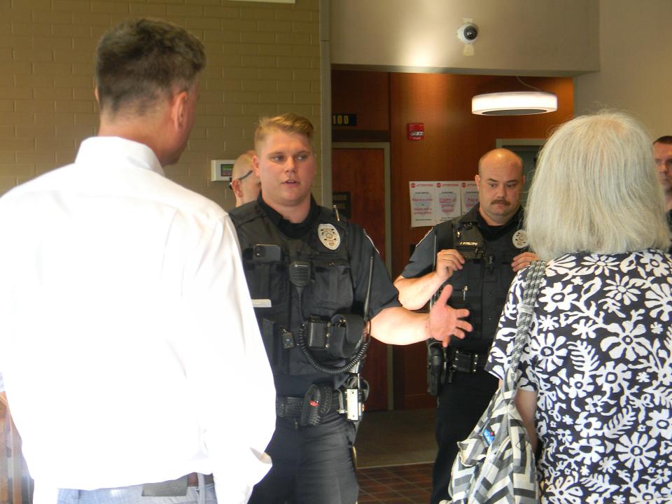 Mayor Pro Tem Rick Chinn, left, and City Council member Ellen Smith, right, talk to Oak Ridge Police Department officers who requested a larger raise after a budget presentation Tuesday, May 31, 2022. Pictured are Officer Kasey Thomas, from left, and Officer Jeremy Phillips. Behind them are Officer Garrett Robbins and Officer Zachery Gauthier.