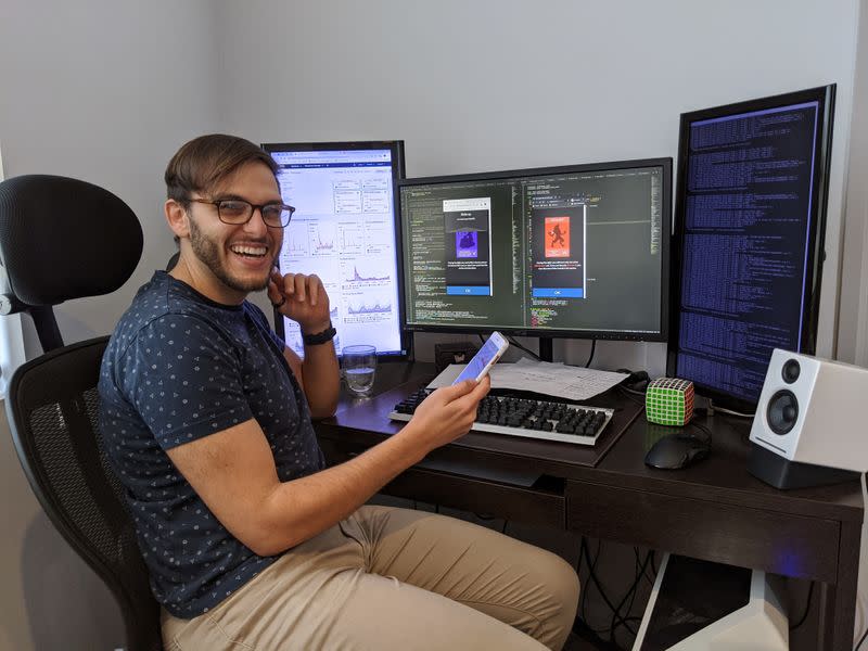 Luke Tsekouras, a site reliability engineer, working on his newly popular games website netgames.io, is seen at his home in Sydney