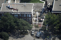 <p>Emergency workers respond to an explosion at Minnehaha Academy in Minneapolis, Aug. 2, 2017. Assistant Fire Chief Bryan Tyner said it appears the explosion may have been caused by a ruptured gas line, but that the investigation is ongoing. (Aaron Lavinsky/Star Tribune via AP) </p>