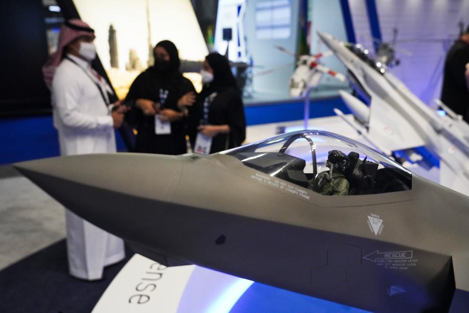 A model F-35 stealth fighter jet is on display at the Lockheed Martin stand at the Dubai Air Show in Dubai, United Arab Emirates, Tuesday, Nov. 16, 2021. The U.S. remains "fully committed" to a proposed sale of advanced F-35 stealth fighter jets to the United Arab Emirates despite the Biden administration slowing down the deal, a senior U.S. official overseeing arms exports told The Associated Press on Tuesday. (AP Photo/Jon Gambrell)