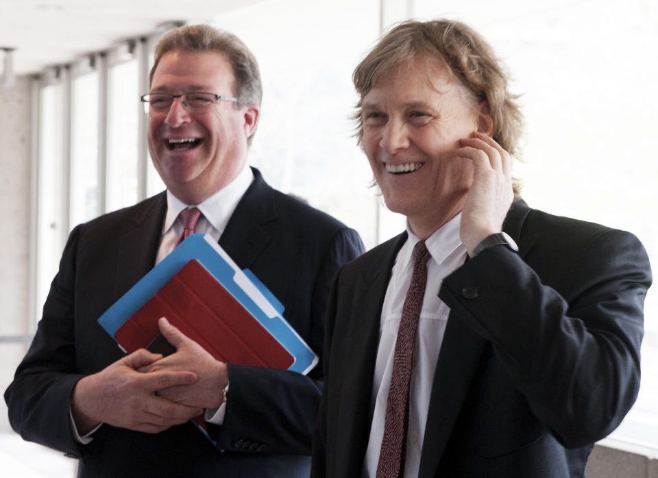 Thomson Reuters President and Chief Executive Officer James Smith (L) and Chariman David Thomson laugh before entering their annual general meeting for shareholders in Toronto, May 8, 2013.  REUTERS/Jon Blacker (CANADA - Tags: BUSINESS)