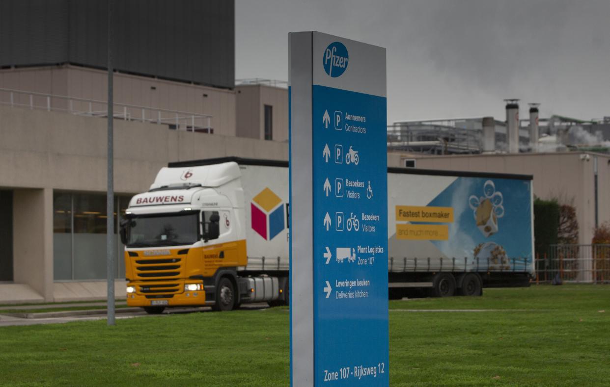 A truck leaves Pfizer Manufacturing in Puurs, Belgium on Wednesday, Dec. 2, 2020. British officials authorized a COVID-19 vaccine for emergency use on Wednesday, greenlighting the world's first shot against the virus that's backed by rigorous science and taking a major step toward eventually ending the pandemic.