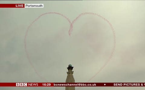 Red Arrow smoke trail in the shape of a heart - Credit: BBC