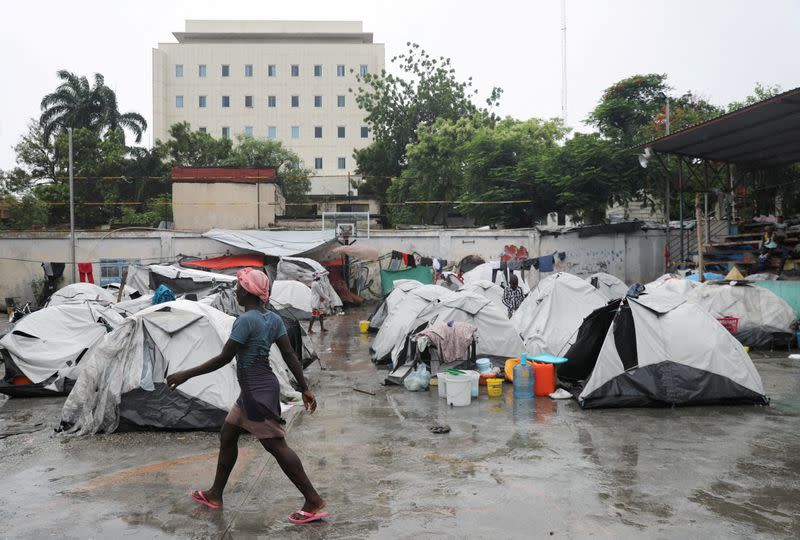 FILE PHOTO: People displaced by gang violence shelter at a school, in Port-au-Prince